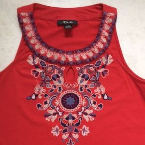 Sleeveless red top w/ embroidered neckline
